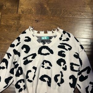 Filly Flair Black and Cream V-Neck Sweater with Animal Print